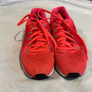 Neon coral/orange Nike running shoes